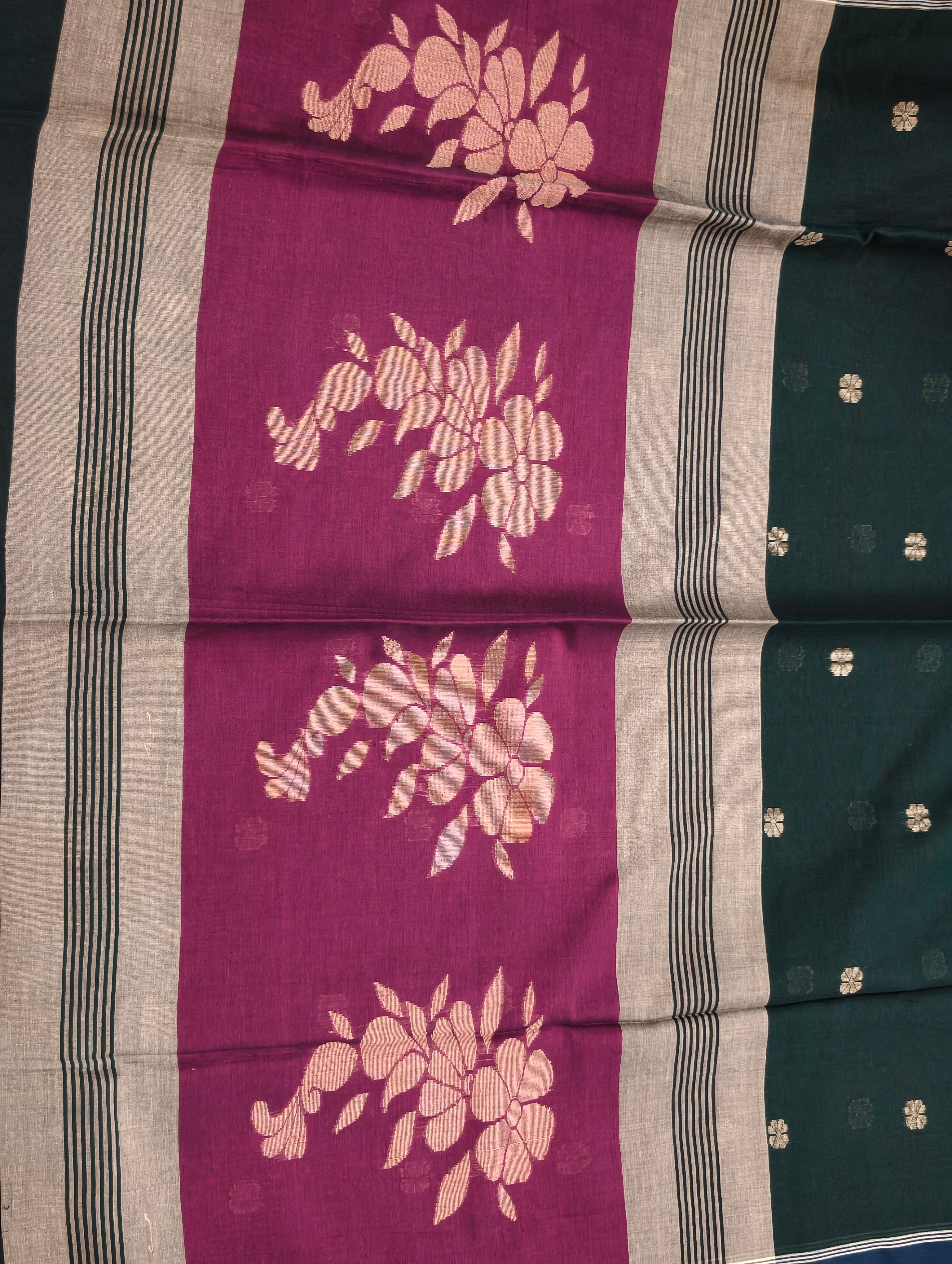 Close-up of magenta floral pallu on Bengal cotton saree