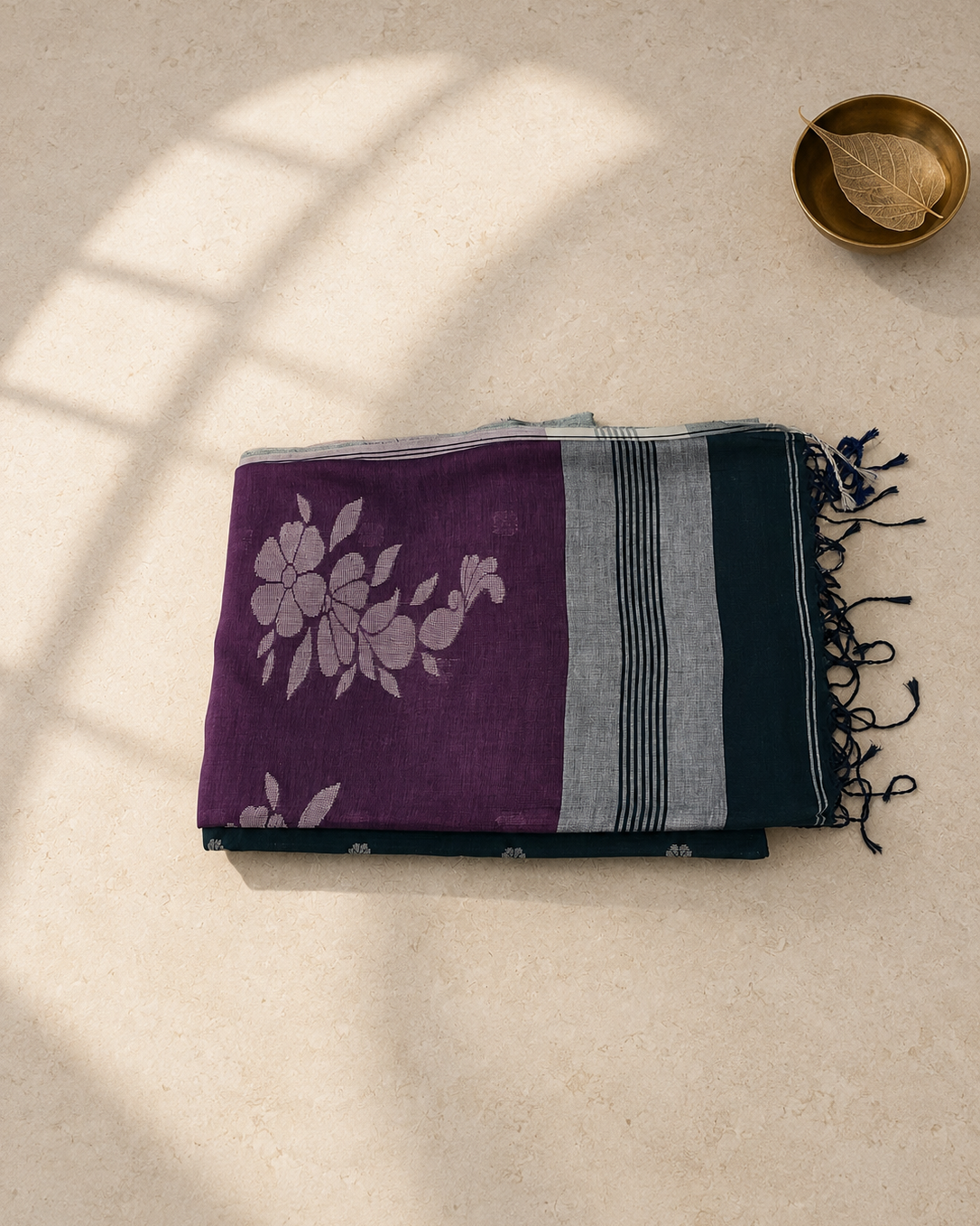 Folded Aaranyaa deep green Bengal cotton saree with magenta floral pallu