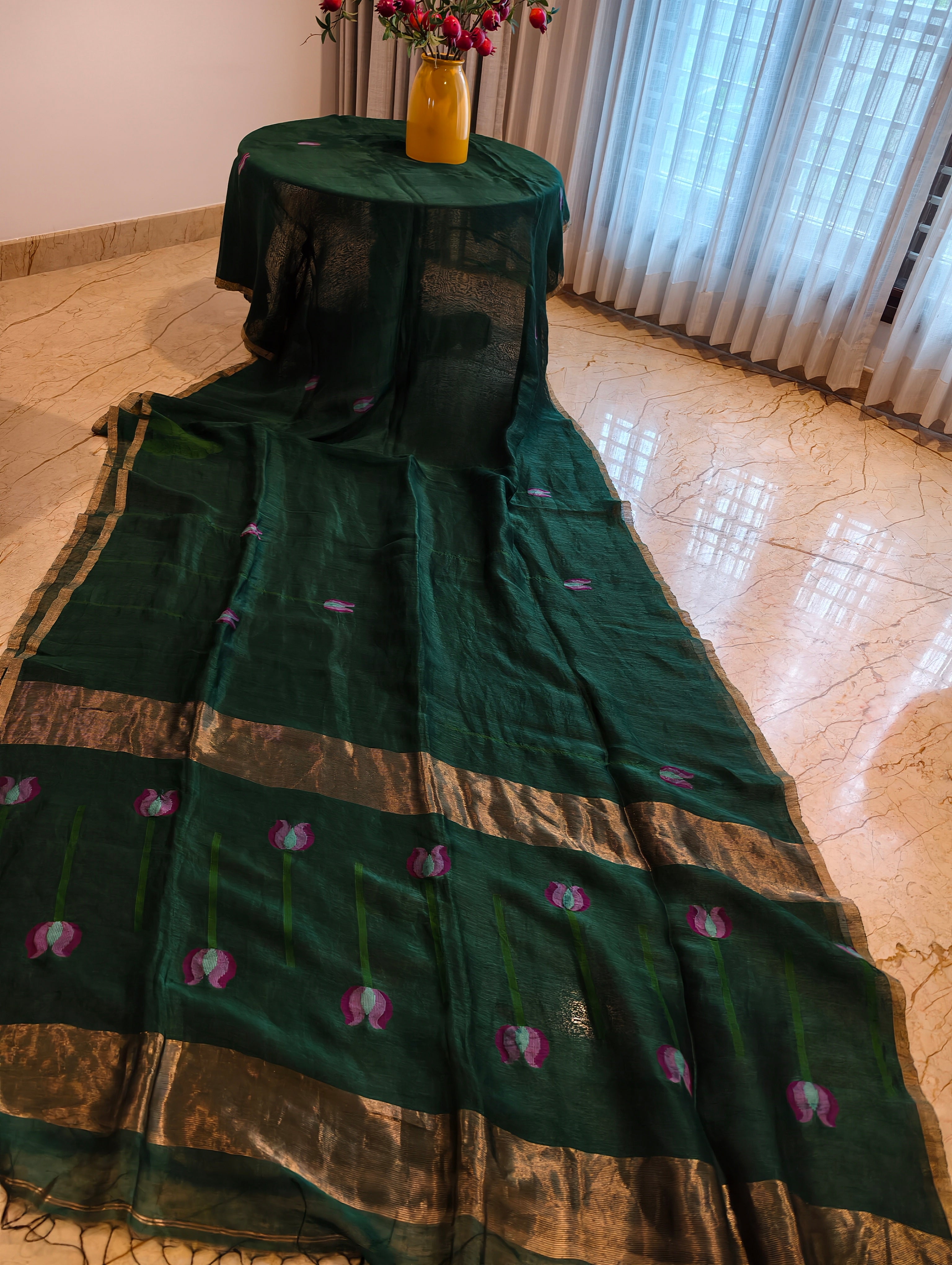 Full view of dark green Matka silk Jamdani saree with woven pink lotus pallu and broad gold zari border – Nayikaa