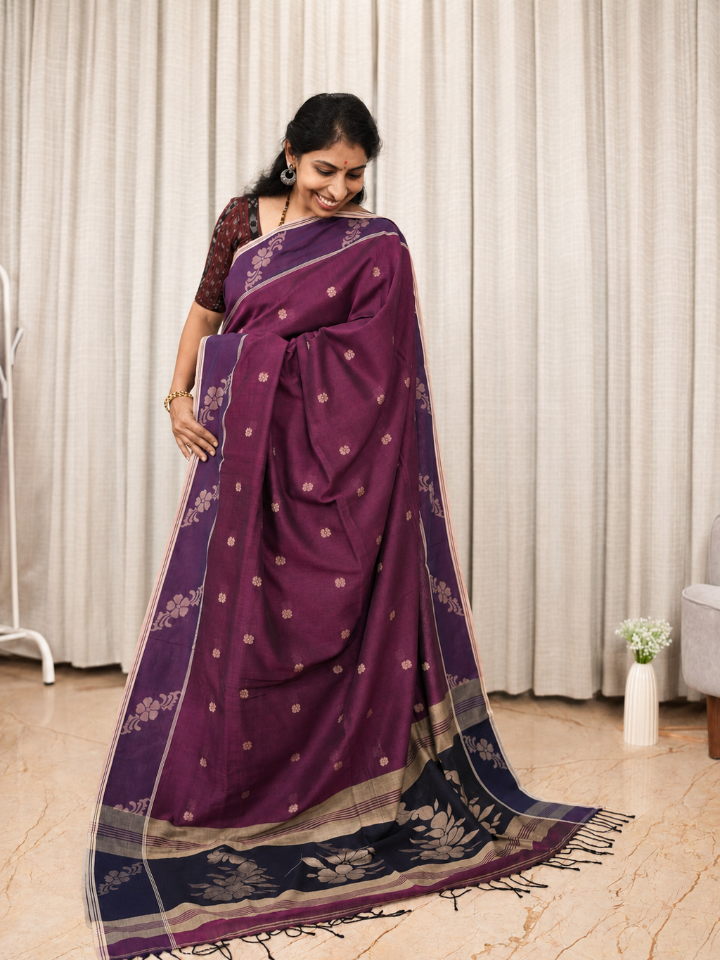 Model wearing Mayurika magenta Bengal cotton saree with navy floral pallu