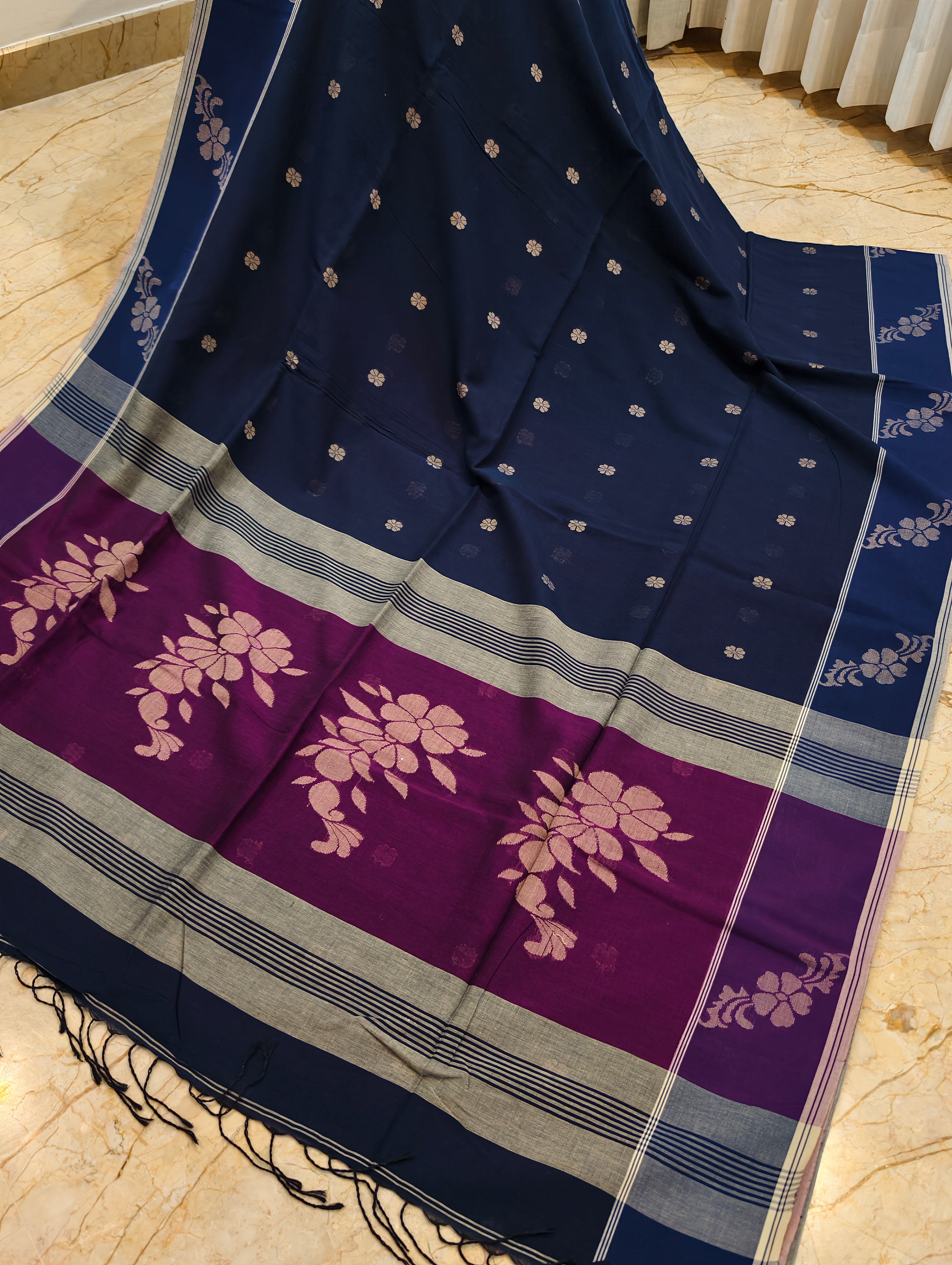 Close-up of navy Bengal cotton saree with magenta floral pallu