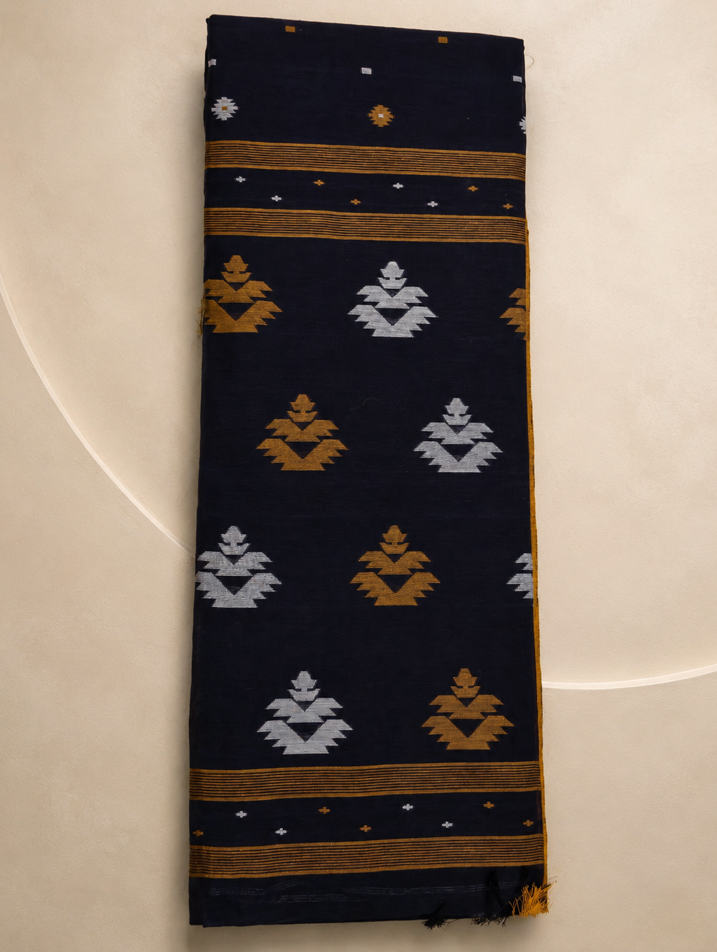 Folded Nishitha navy blue Bengal cotton saree with mustard and white pallu motifs