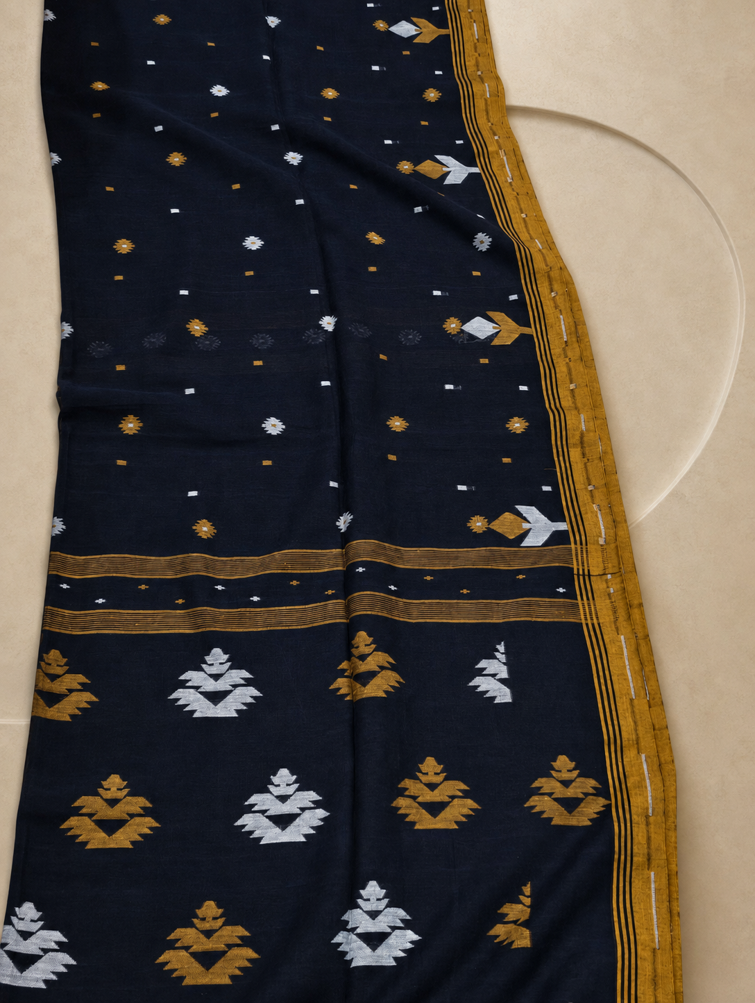 Navy blue Bengal cotton saree pallu with mustard and white geometric woven motifs