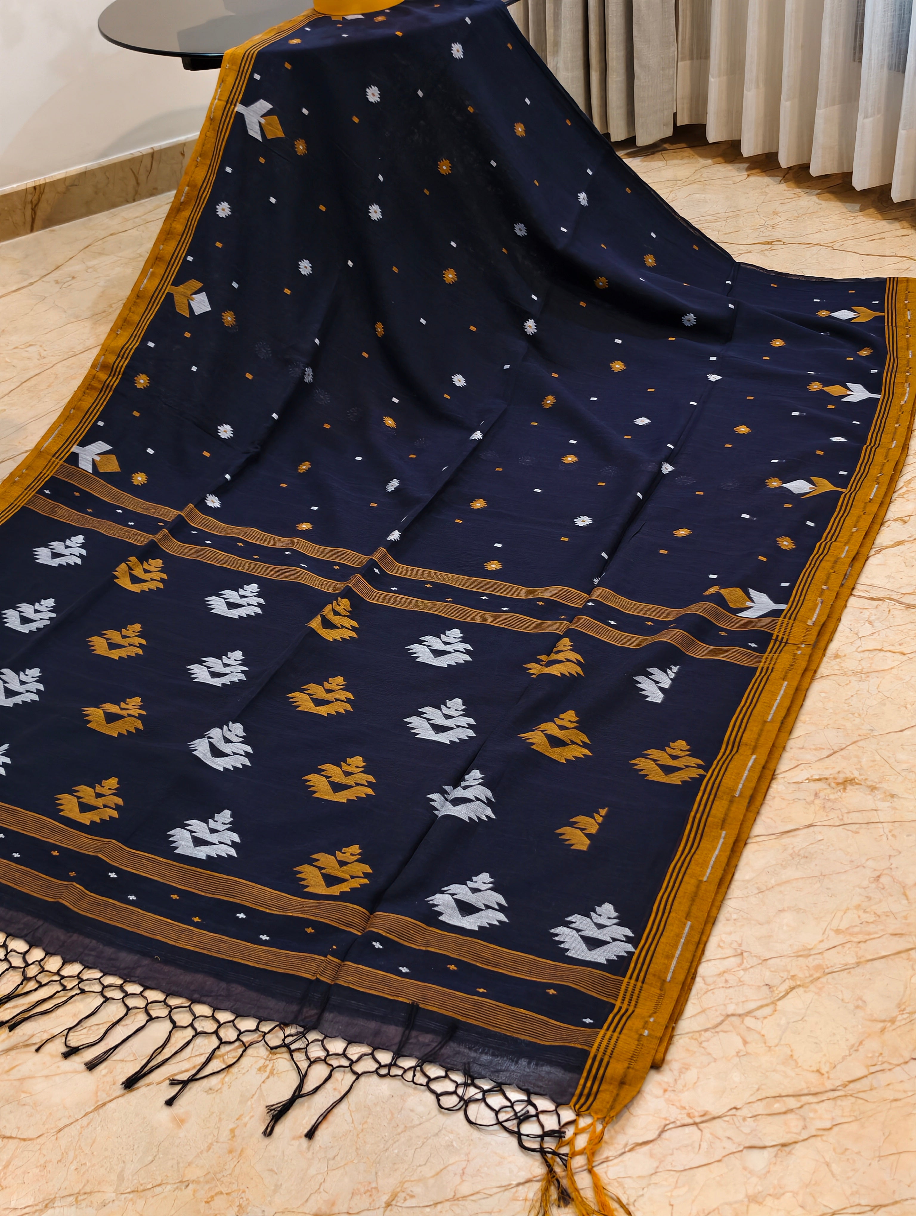 Navy blue Bengal cotton saree displayed with mustard border and contrasting woven pallu