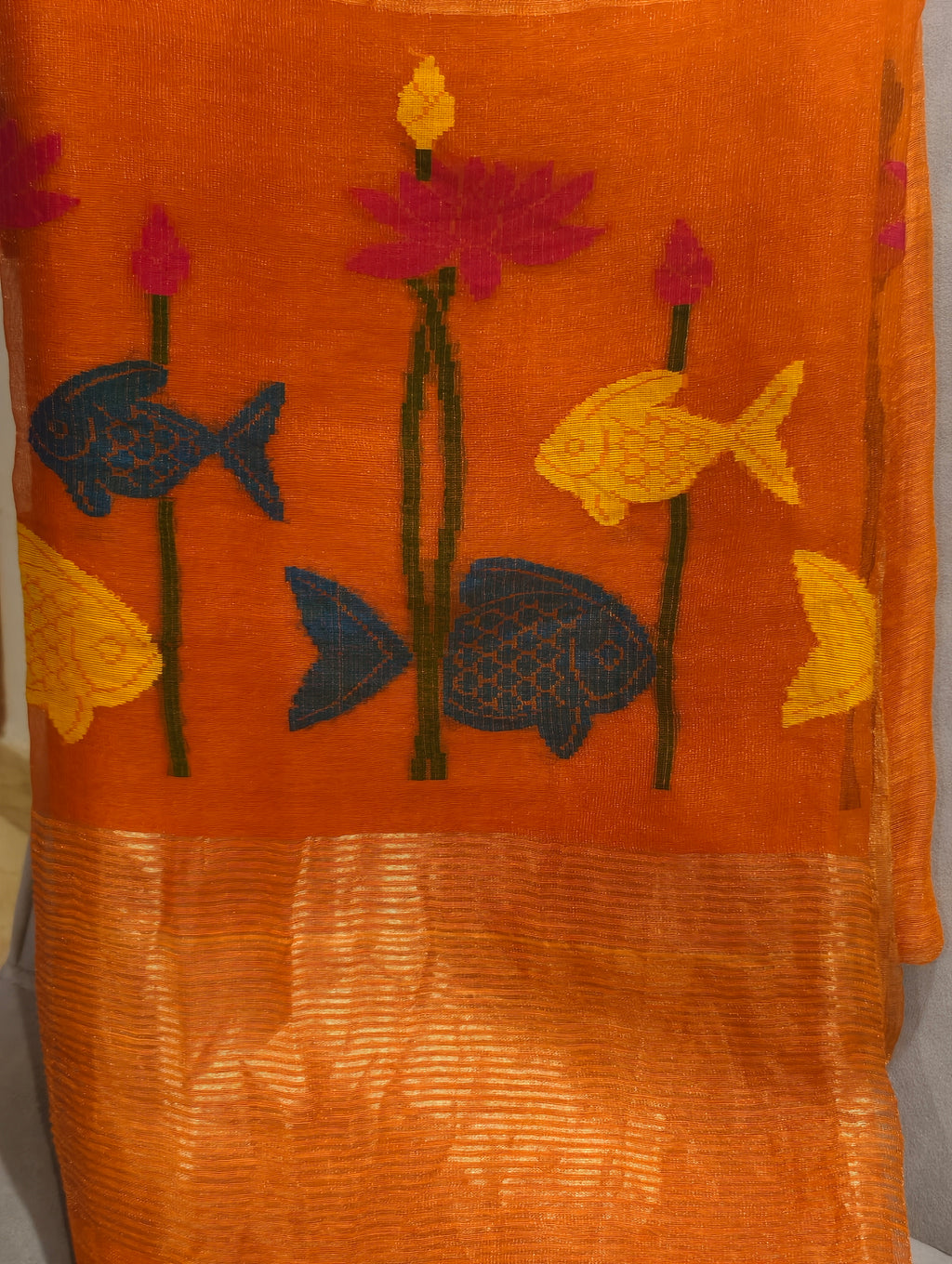 Woven blue and yellow fish with pink lotus motifs on orange Matka silk Jamdani saree – Nayikaa