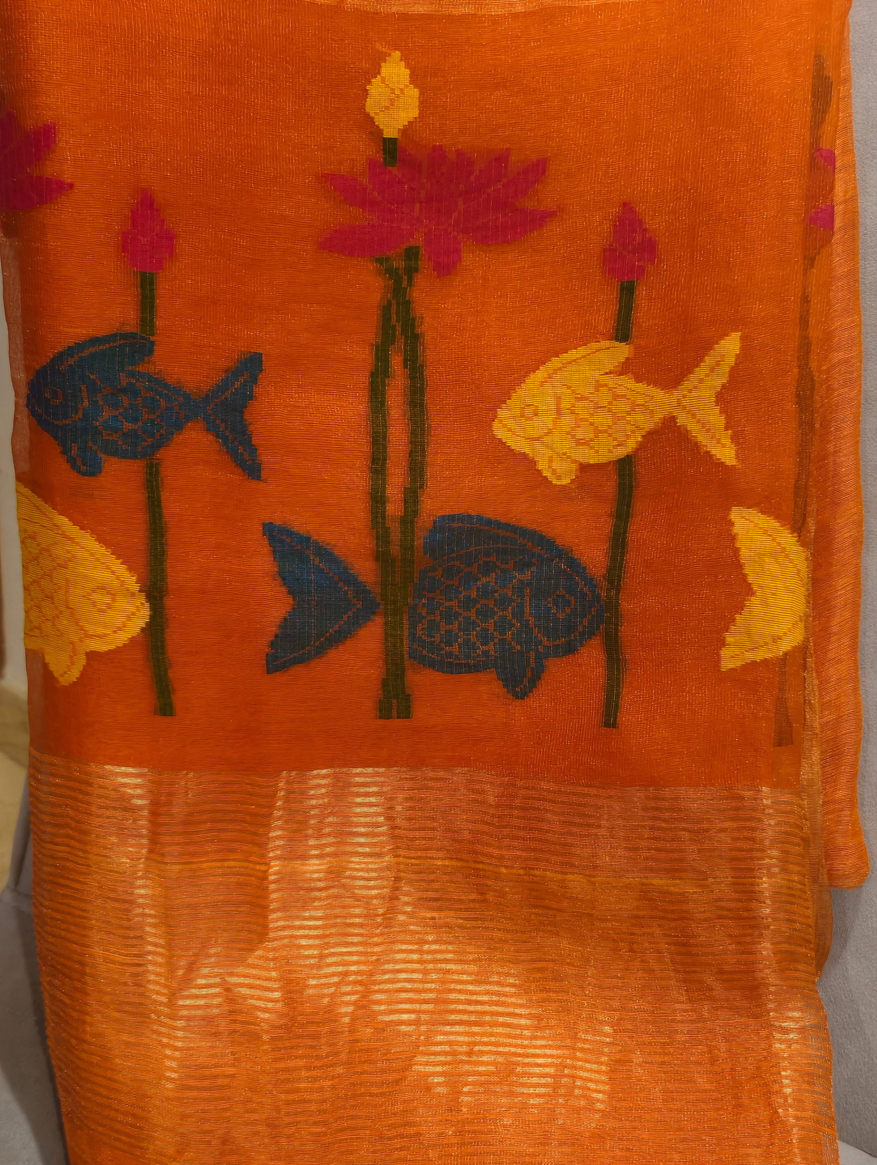 Woven blue and yellow fish with pink lotus motifs on orange Matka silk Jamdani saree – Nayikaa