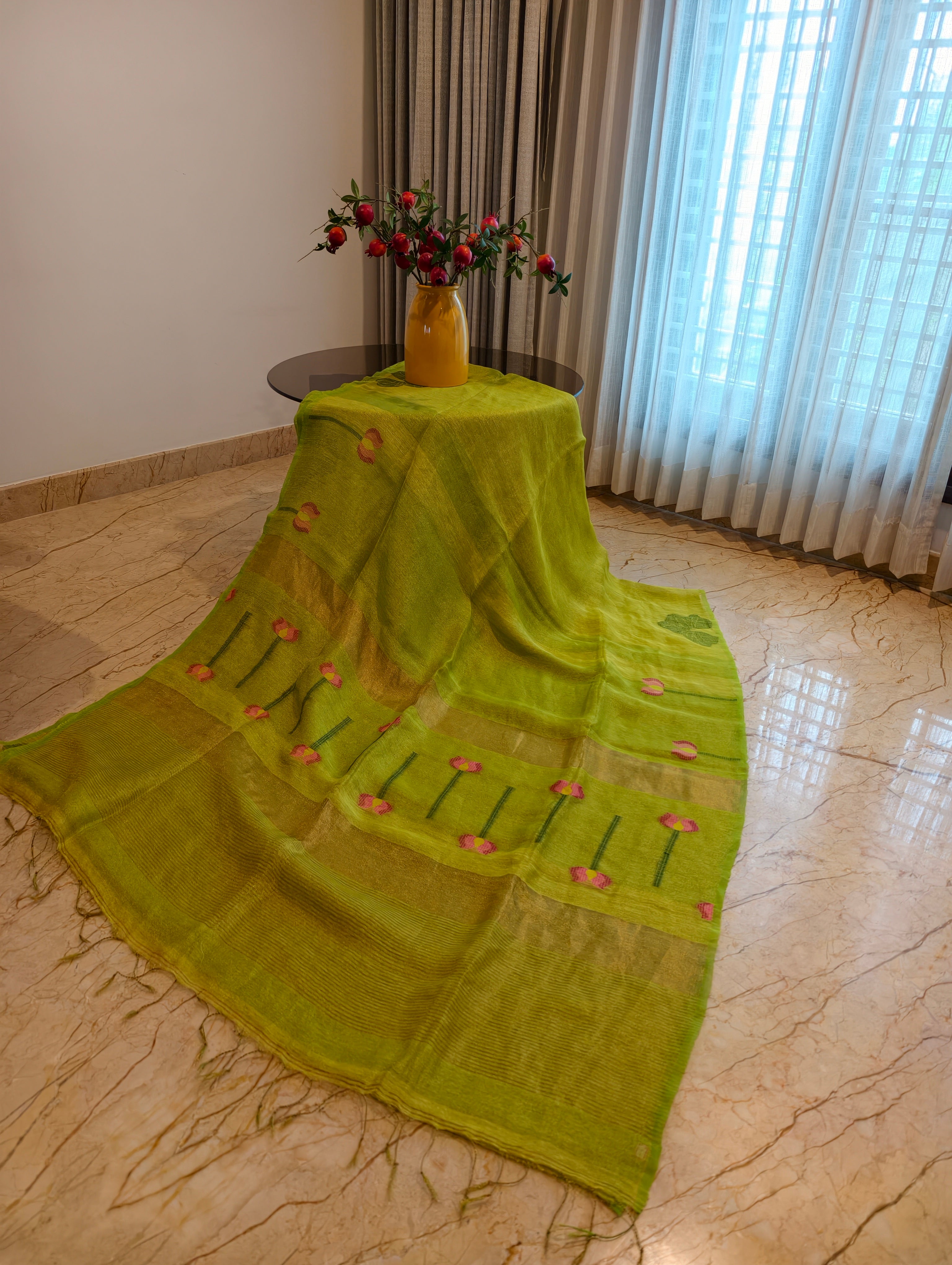 Parrot green linen silk saree with woven floral pallu, gold zari and tassels – Nayikaa