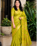 Modal wearing parrot green linen silk saree with floral pallu and gold zari border – Nayikaa
