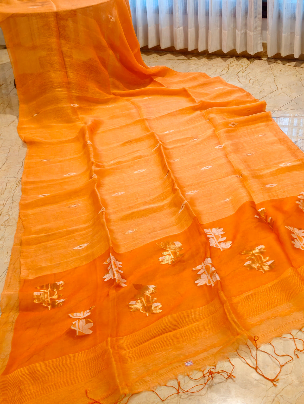 Orange Matka Muslin Jamdani saree with handwoven motifs and border