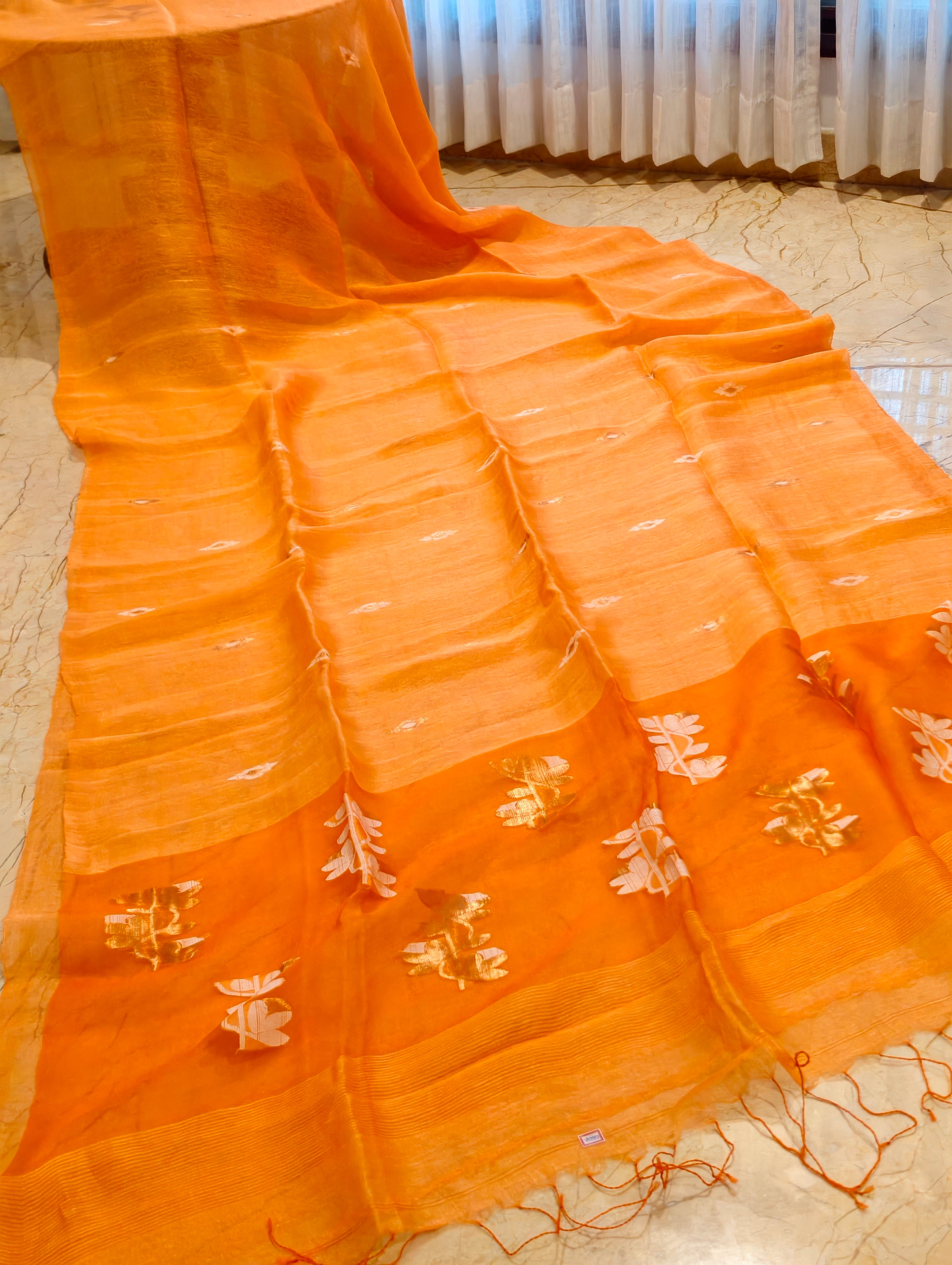Orange Matka Muslin Jamdani saree with handwoven motifs and border