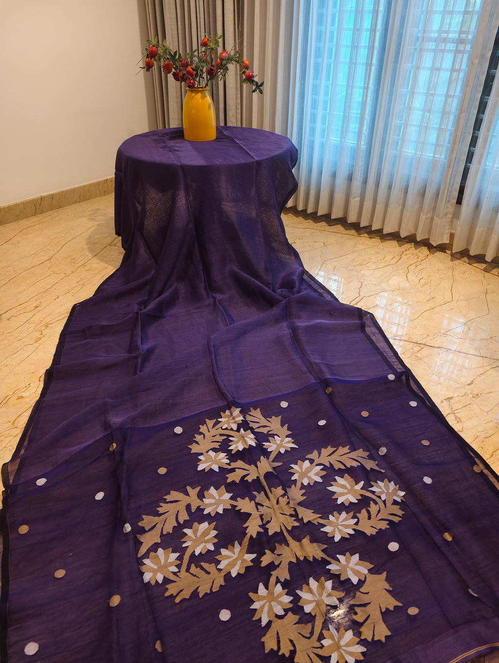 Full view of purple Matka Muslin Jamdani saree with gold and white floral pallu
