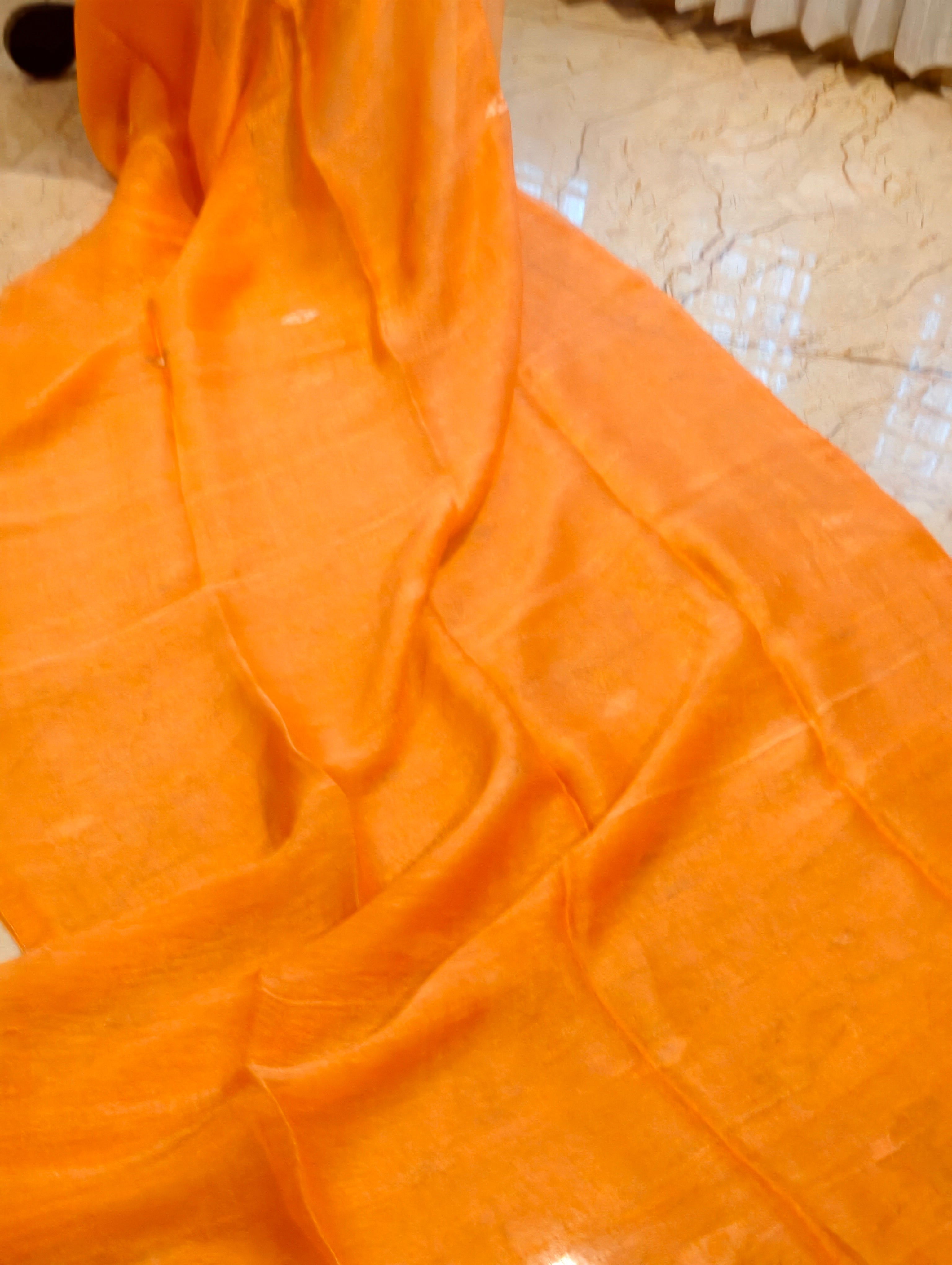 Orange Matka Muslin Jamdani saree body showing natural handwoven texture and sheen