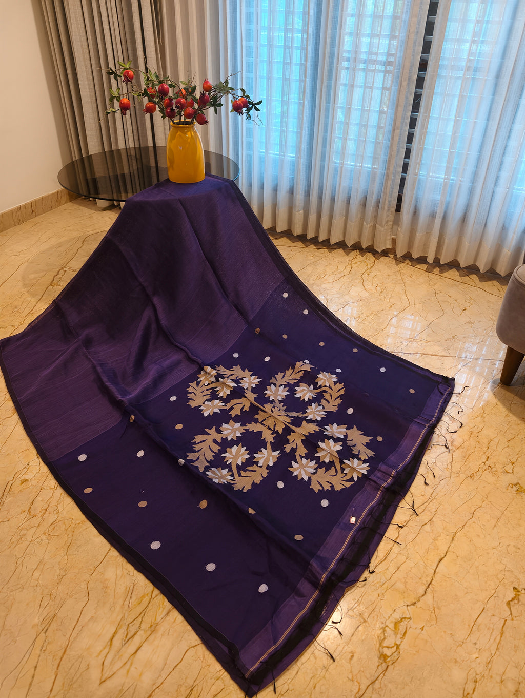 Purple Matka Muslin Jamdani saree showcasing the handwoven floral pallu and dotted motifs