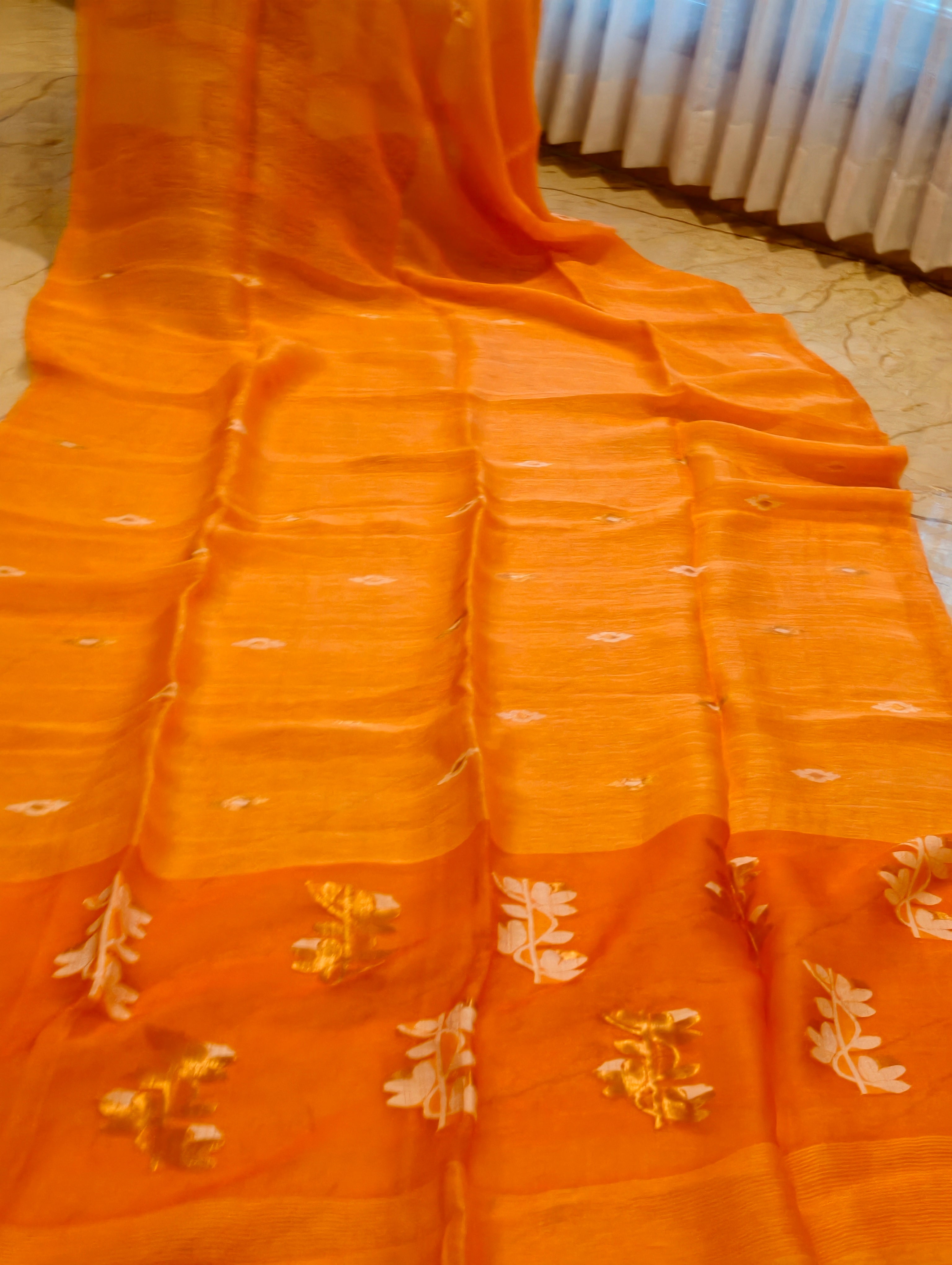 Orange Matka Muslin Jamdani saree with white and gold handwoven motifs