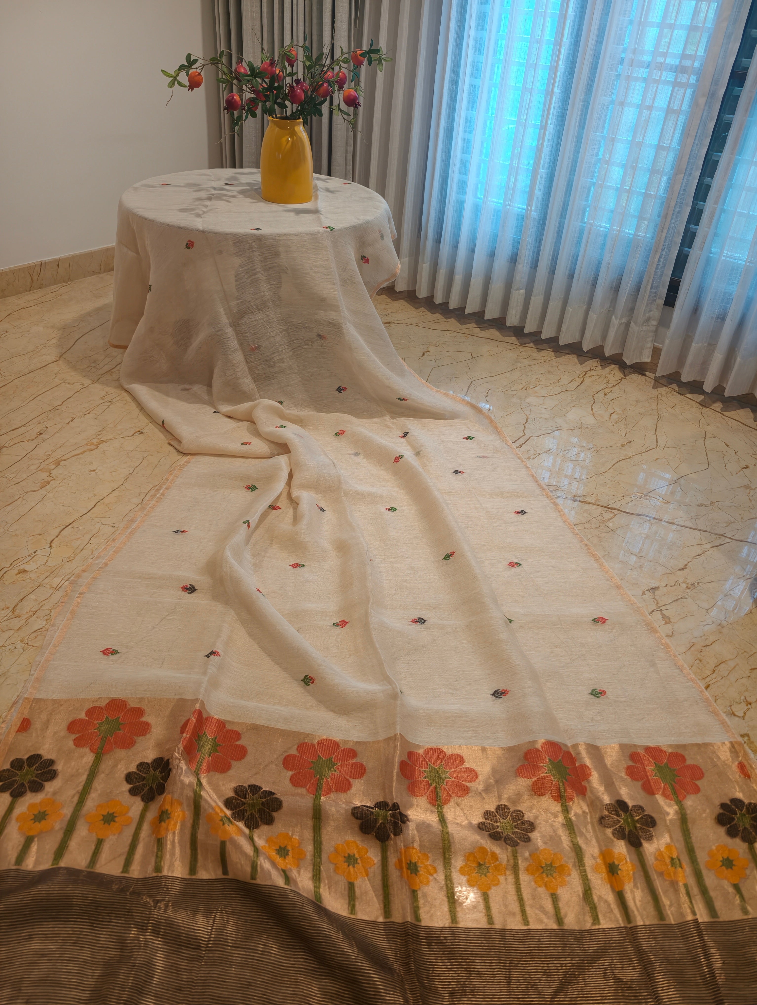 White Matka silk Jamdani saree with woven floral pallu and contrasting dark zari border – Nayikaa